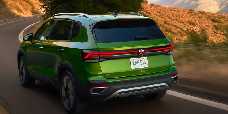 Rear driving view of Taos SUV